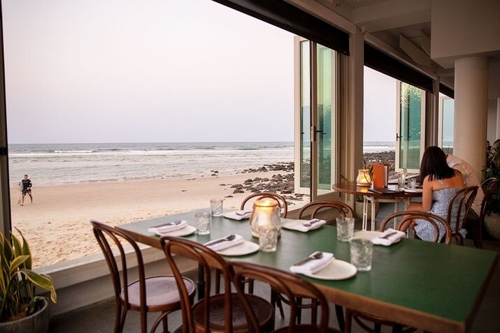 Oceanfront dinner setup at Rick Shores—one of the top date ideas Gold Coast couples enjoy for scenic views and intimate dining.